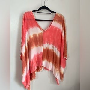 Poncho style top. Super pretty colors.  Super cute for a coverup too!